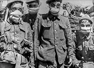 British WW1 soldiers wearing rudimentary gas masks in trench on the battlefield during World War One as protection
