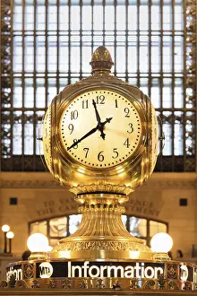 Bronze clock above the information desk