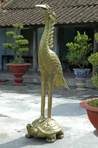 Bronze statue of a crane standing on a tortoise