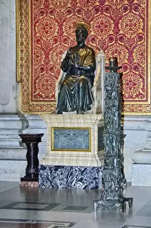 Bronze statue of Saint Peter on marble pedestal in St