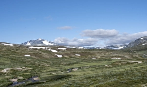 Brook in the fjell, behind mountain Snohetta