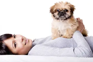 Brunette woman with a cute little pekingese