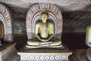 Buddha figure inside Dambulla cave Buddhist temple complex
