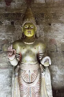 Buddha figure inside Dambulla cave Buddhist temple complex