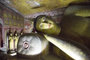Buddha figure inside Dambulla cave Buddhist temple complex