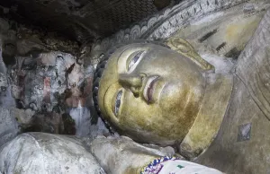 Buddha figure inside Dambulla cave Buddhist temple complex