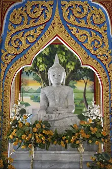 Buddha figures inside the Chedi at Wat Chalong in Chalong on Phuket isalnd in Thailand