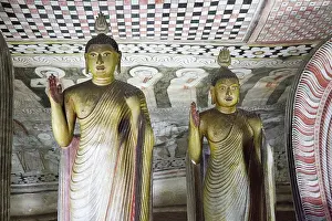 Buddha figures inside Dambulla cave Buddhist temple complex