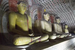 Buddha figures inside Dambulla cave Buddhist temple complex
