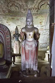 Buddha figures inside Dambulla cave Buddhist temple complex