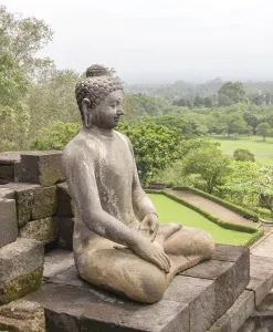 Framed Print : Buddha sculpture at a temple named Borobudur located in Java Framed Print : Buddha sculpture at a temple named Borobudur located in Java