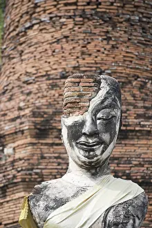 A buddha at a smal Temple of the Historical park in the city of Ayutthaya north of bangkok in Thailand in southeastasia