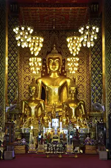 Buddha statue in the chapel of Wat Phra That Hariphunchai temple at Lamphun Province Thailand