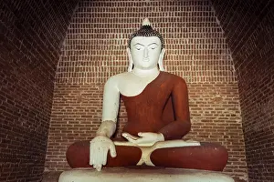 Buddha statue inside ancient Buddhist Pagoda ruins
