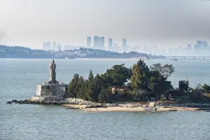 Buddha statue on an island with Xiamen in the background