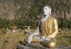 Buddha statue in Lumbini Garden under Mt Zwegabin, Hpa-an, Karen, Kayin State, Myanmar, Asia