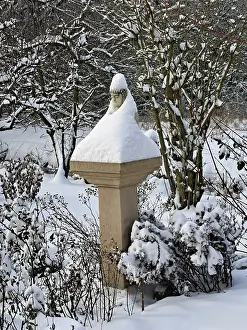 Framed Print : Buddha statue on a pillar has put on a snow coat