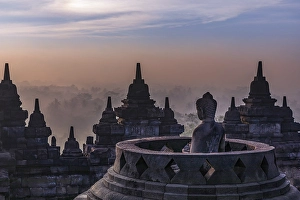 Buddha statue at sunrise, Borobudur temple complex