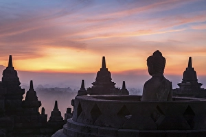 Buddha statue at sunrise, Borobudur temple complex