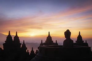 Buddha statue at sunrise, Borobudur temple complex