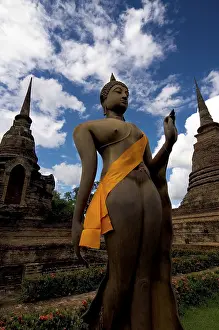 Buddha statue in front of a temple