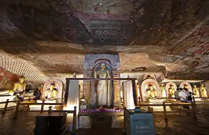 Buddha statues and ceiling fresco in the Dambulla cave temple