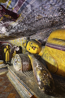 Category Buddhism Prints: Buddha statues and murals in one of the cave temples of the Golden Temple