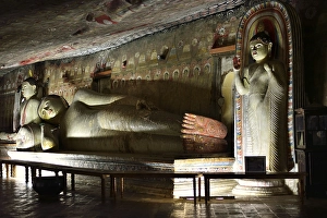 Buddha statues and murals in one of the cave temples of the Golden Temple