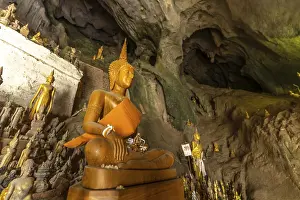 Buddha statues in the Pak Ou caves near Luang Prabang