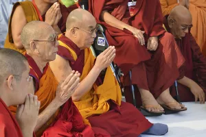 Buddhism, the Dalai Lama in a communal prayer with dignitaries