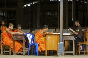 Buddhist monks being taught in a monastery school