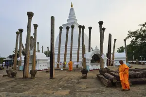 Buddhist monks in front of the Thurparamaya Stupa