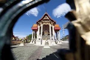 Buddhist pagoda, part of temple complex under blue sky