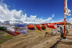 Buddhist prayer flages lungta in Buddhist Monastery in Comic Village