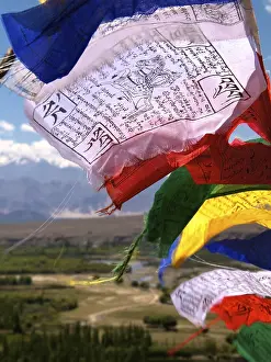Buddhist prayer flags blowing in the wind