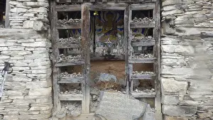 Buddhist stone shrine with religious motif