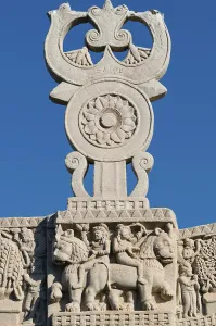 Buddhist symbols, Shrivatsa in Triratana over the chakra wheel on Torana