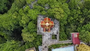 A buddhist temple on a mountain in Cambodia seen from above