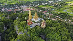 A buddhist temple on a mountain in Cambodia seen from above