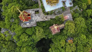 A buddhist temple on a mountain in Cambodia seen from above