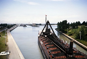 Bulk carrier Midland Prince cargo ship (1907-1968) in lock of Welland canal, St Lawrence seaway, Great Lakes, Ontario, Canada, North America 1963, North America