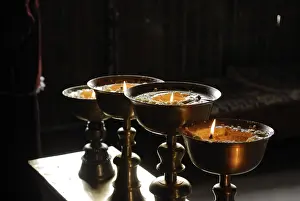 Burning butter lamps in Mindroling Monastery