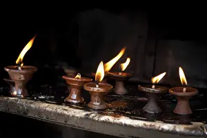 Burning oil lamps at Indian temple. Nepal