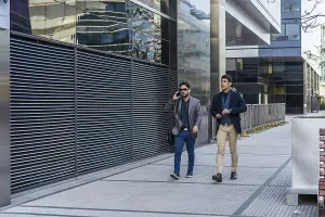Two business colleagues are walking on the street