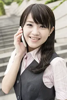 Business woman of Asian talk on cellphone