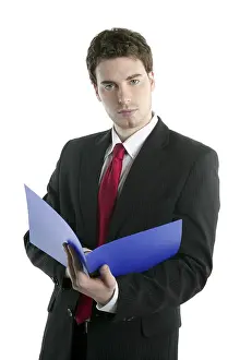 Businessman holding blue open folder over white studio background