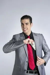 Businessman young with dollar notes suit and tie on gray background