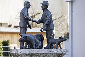 Butcher and farmer haggle over the price of a pig