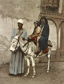 Cairo. Arab woman and her jackass child