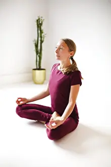 Framed Print : Calm female in sportswear practicing yoga in Firefly pose while balancing and looking away